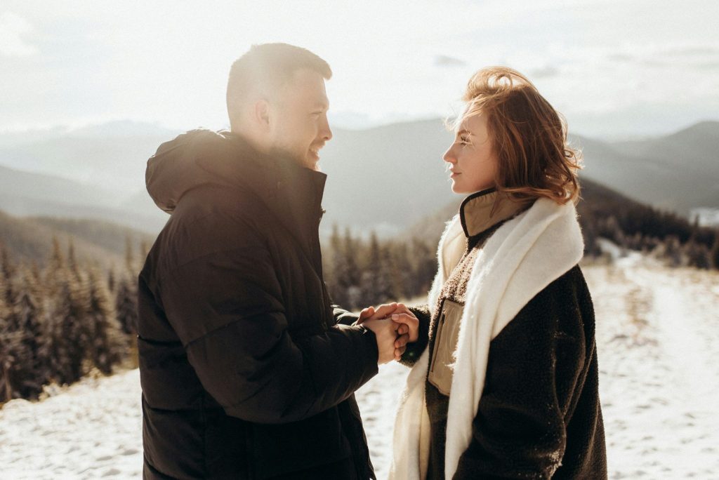 A man and woman holding hands