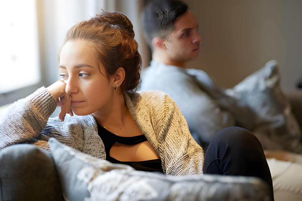Woman looking despondent after a fight with her boyfriend