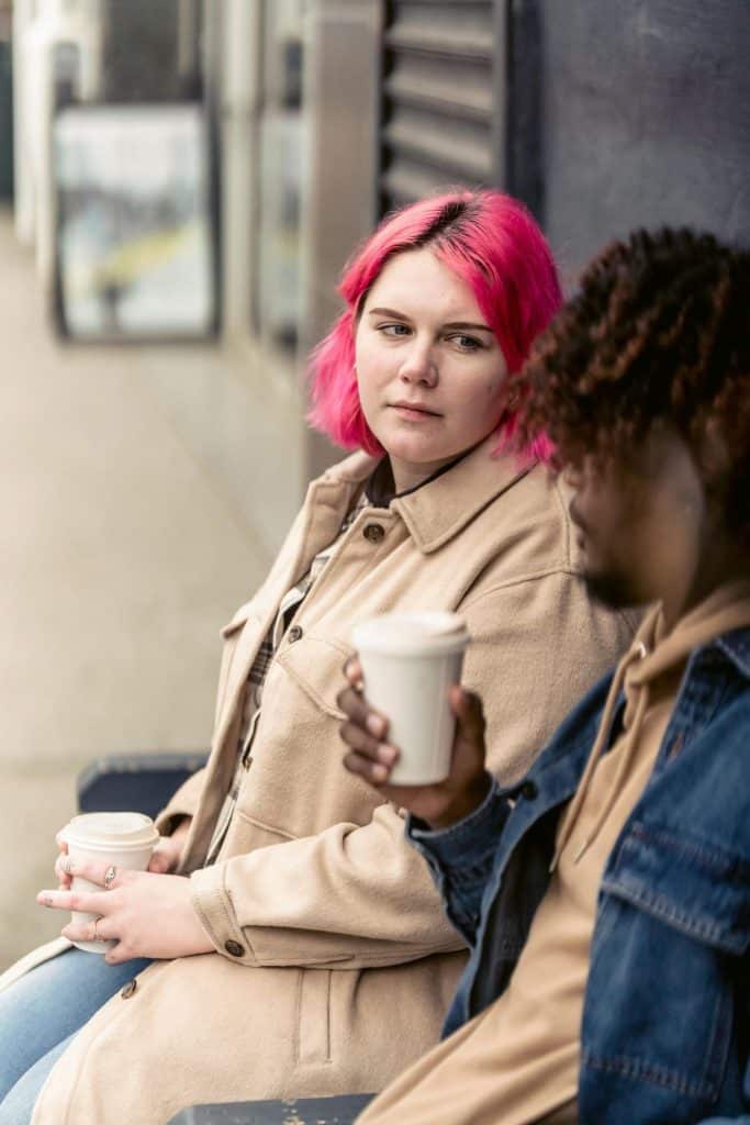 A woman looking at the man