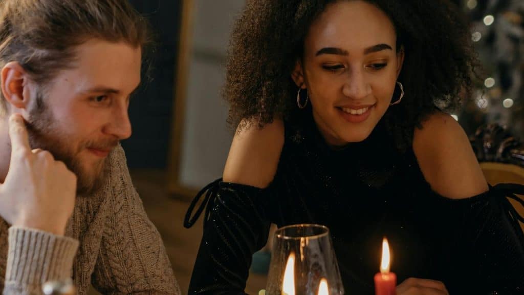 A couple enjoying a candlelit dinner together