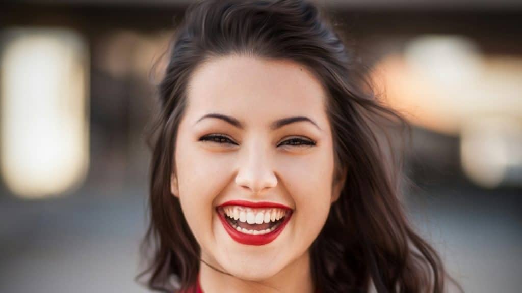 A woman smiling at the camera.