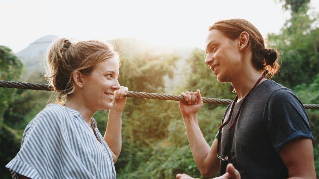 A man talking to woman