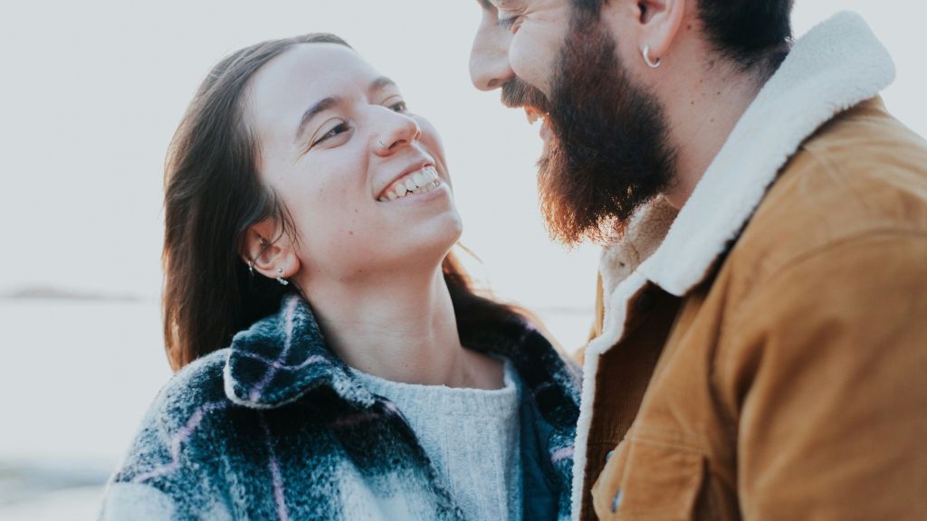 A man and woman looking at each other