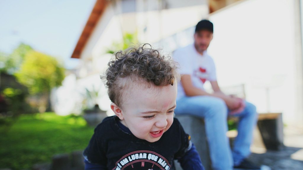 A man looking at his kid