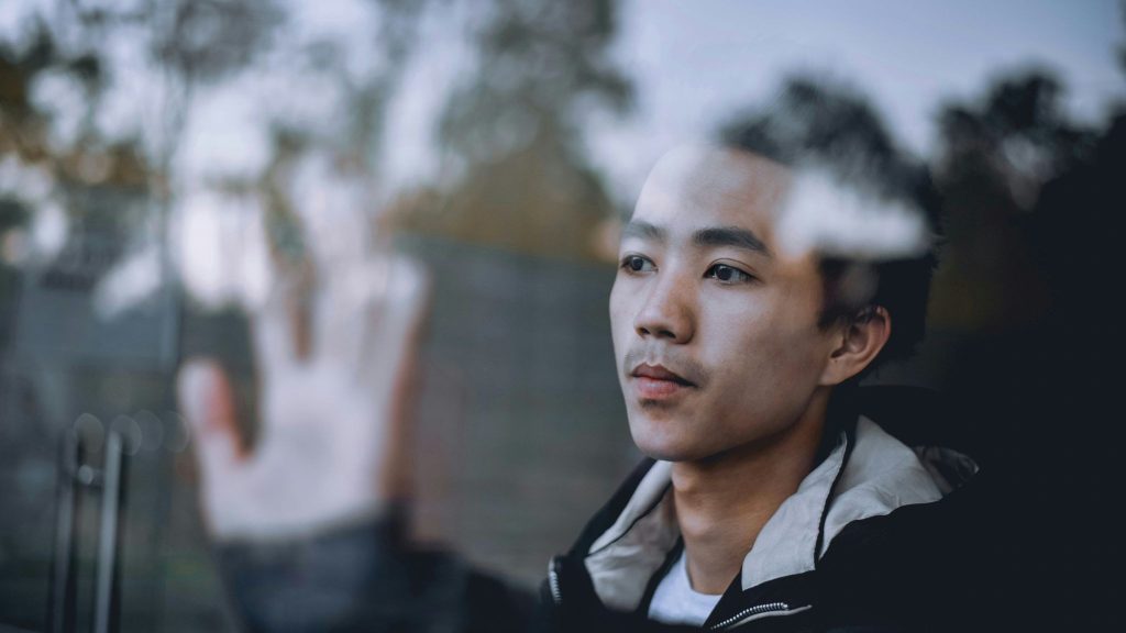 A man looking at the window