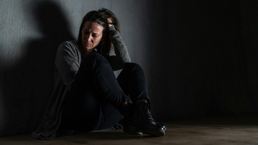 Woman sitting on the floor