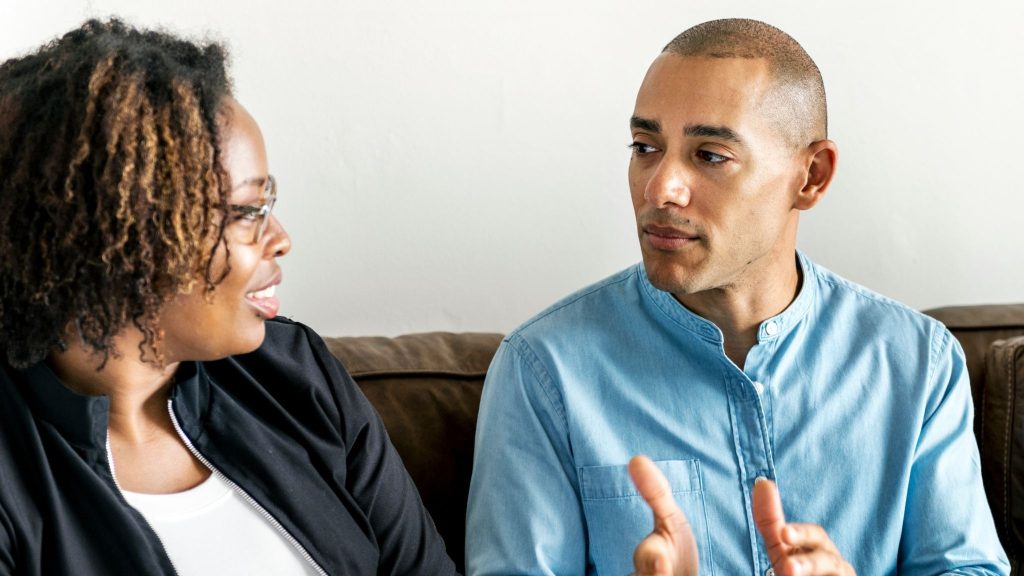 A man and woman talking