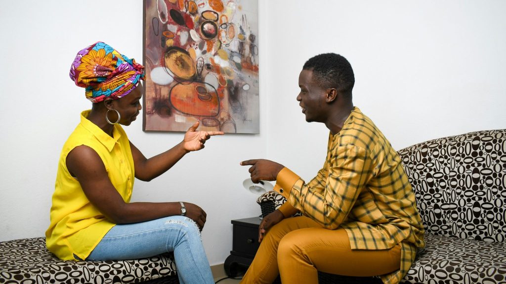 A man commenting something to woman