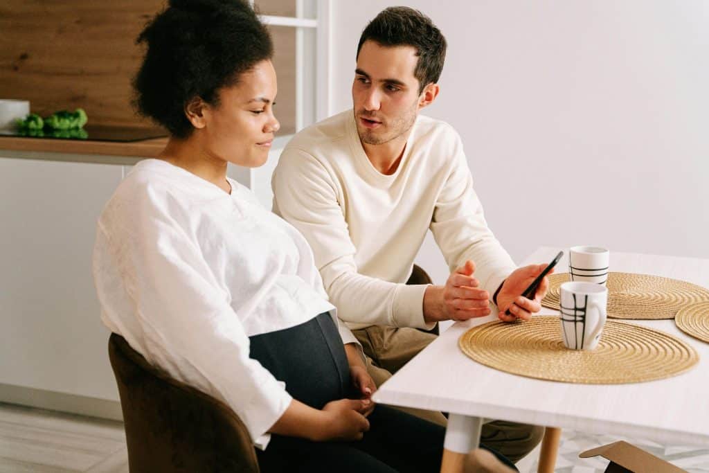 A man and woman talking deeply.