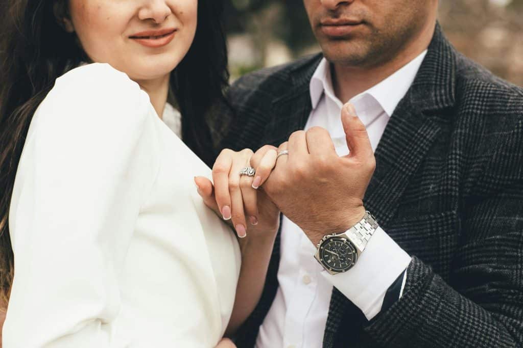 A man and woman hugging deeply.