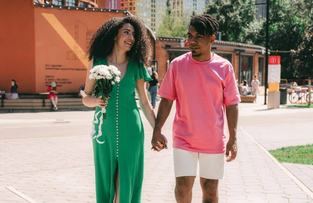 A man and woman holding hands.