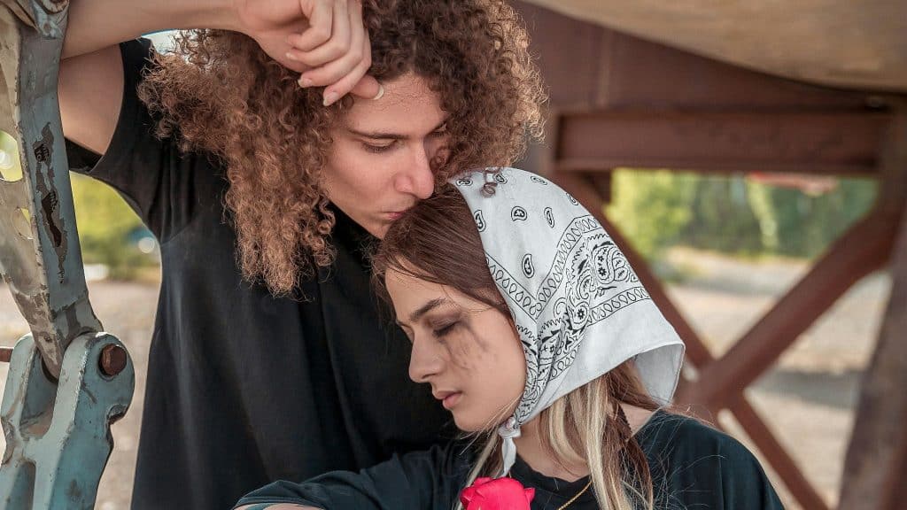 Woman crying and a man trying to comfort her