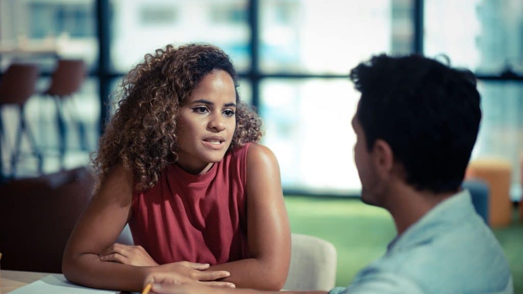 A woman explaining something to woman