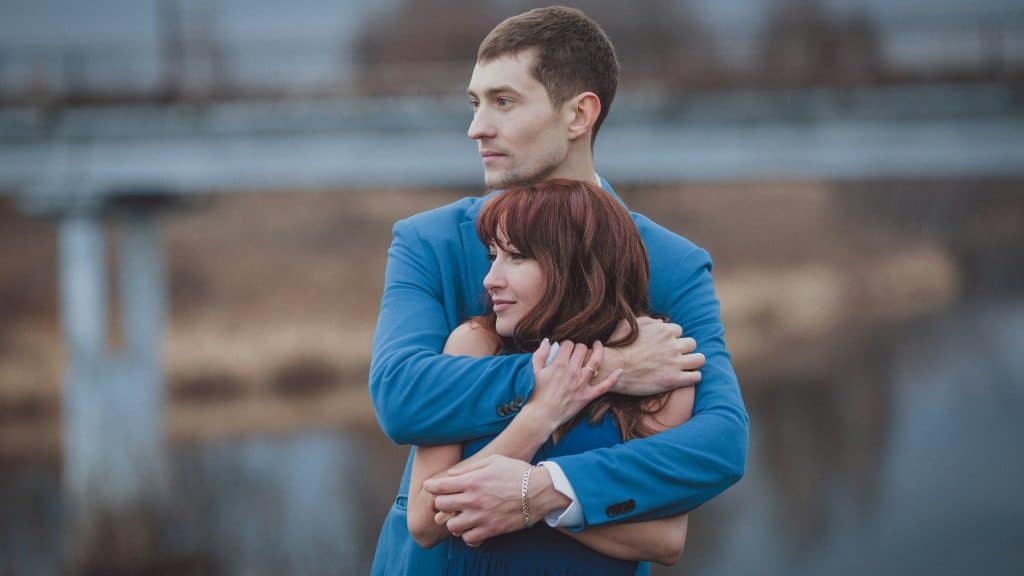 A man hugging a woman