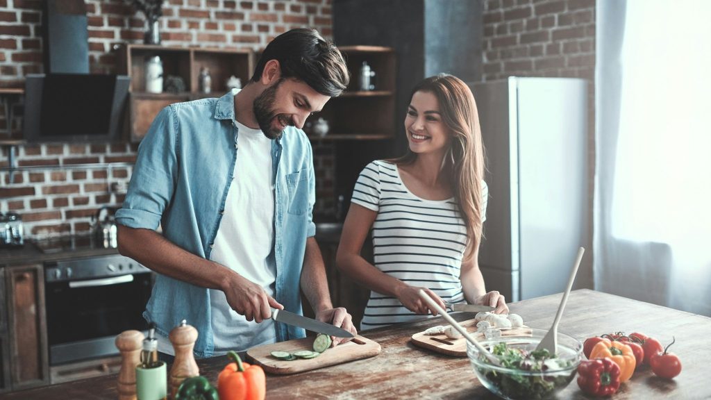 A man and woman at the kitchen