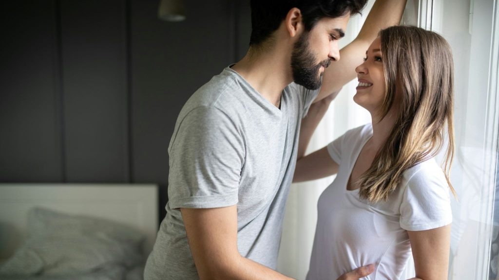 A man and woman facing each other
