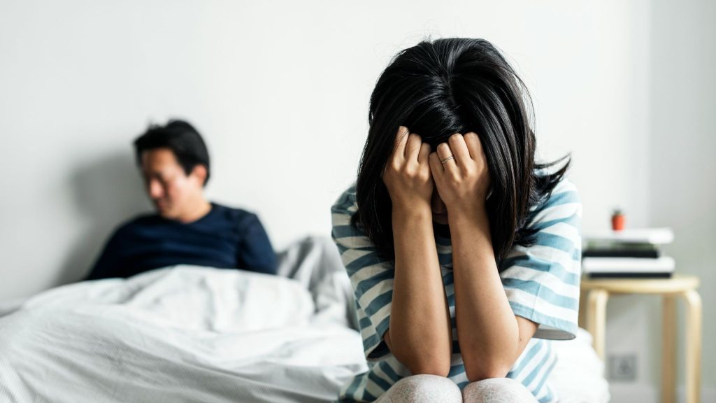 A woman crying and ignoring a mana