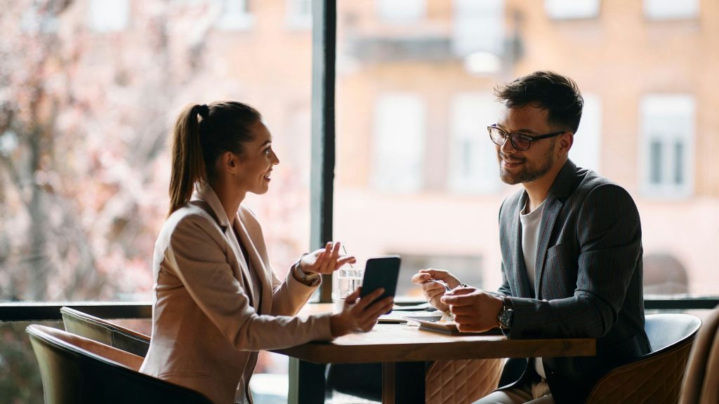 A man talking to woman