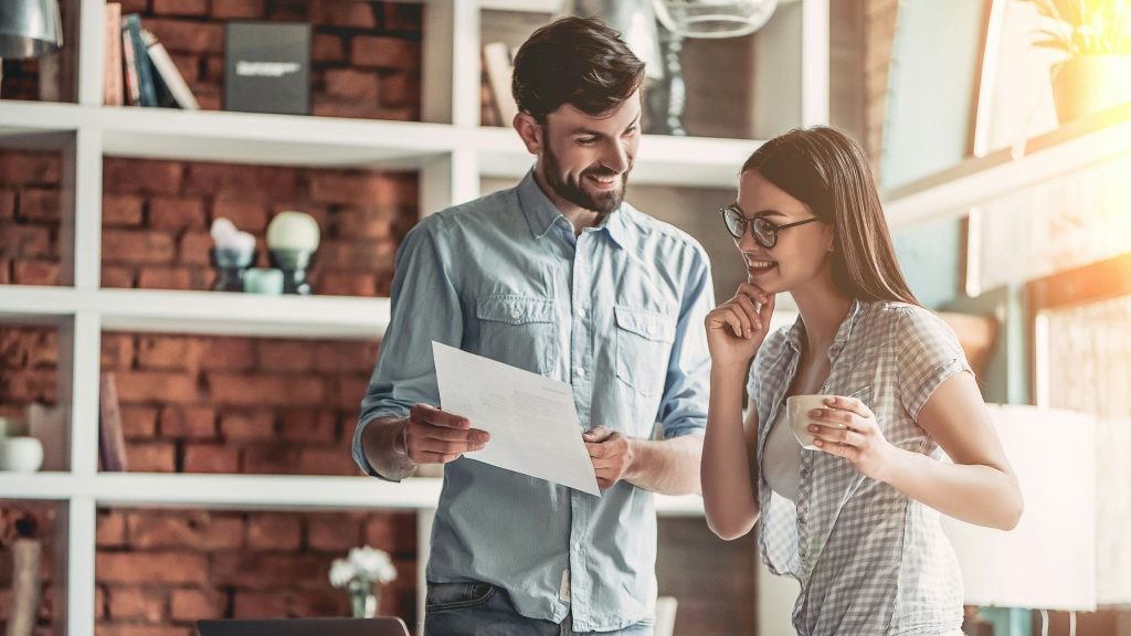 A man explaining something to woman