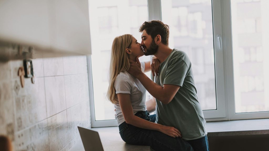 A man and woman kissing
