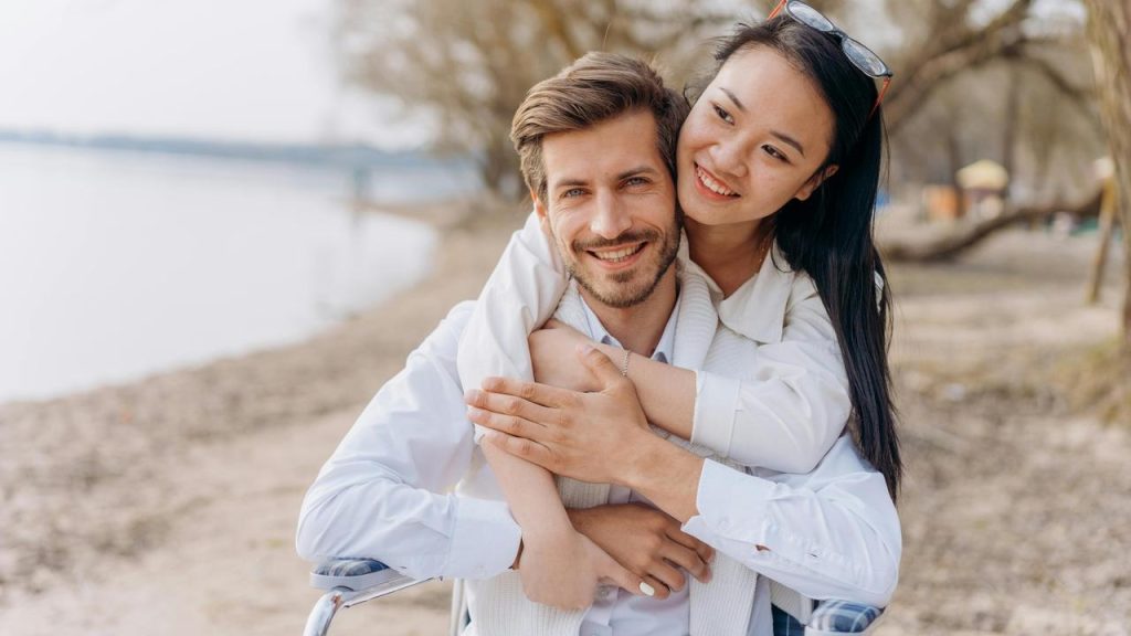 A smiling couple hugging