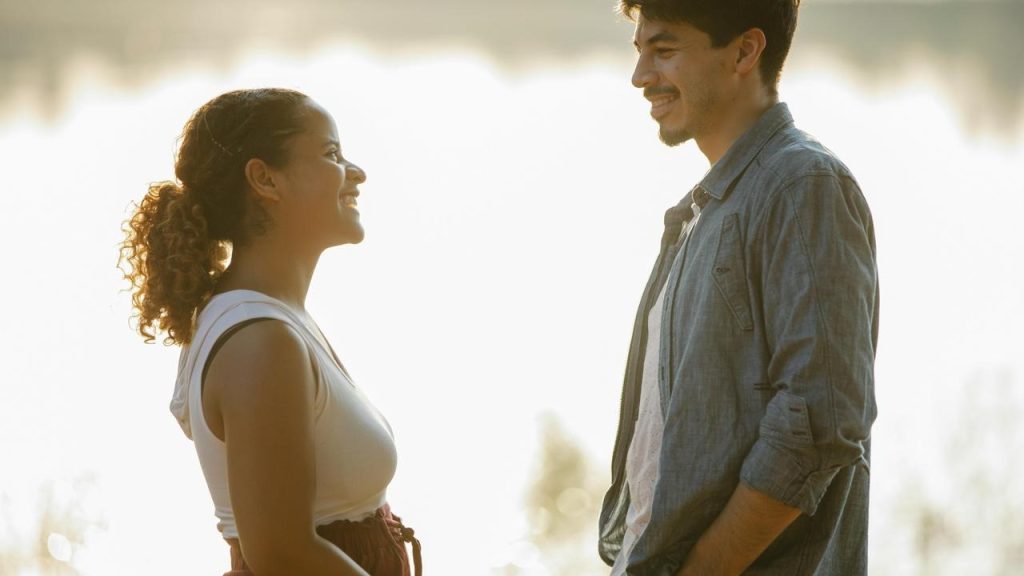A smiling couple facing each other