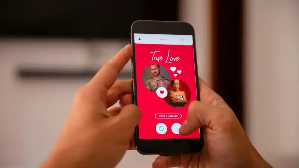 A person holding a cell phone with a picture on the screen.
